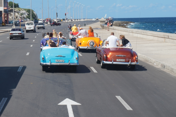 Russians celebrate a wedding in classic old cars. Photo by Anne Ellis