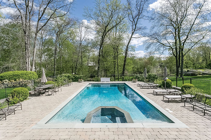 The classic rectangular pool has nearby changing rooms.